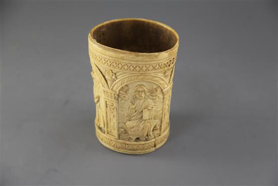 A carved ivory situla, late 19th century in Medieval style, height 6.5in.